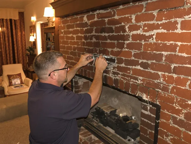 Culver City Chimney Sweep expert fixing a fireplace in Culver City, CA